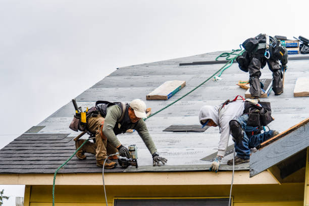 Professional Roofing technician working in North Waltham, MA